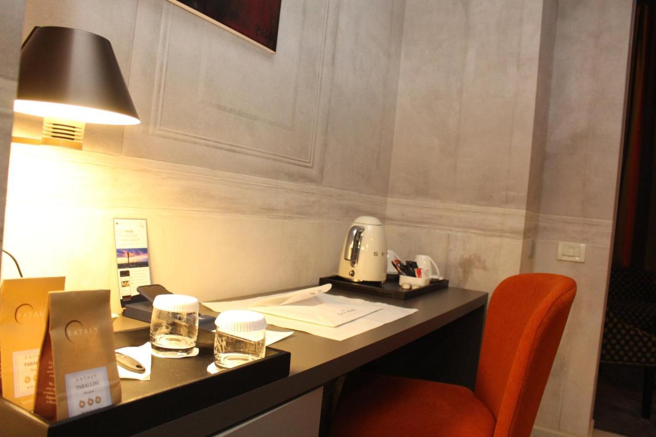 Fifty House Cellini Hotel Milan Exterior photo A Nespresso machine in a hotel room