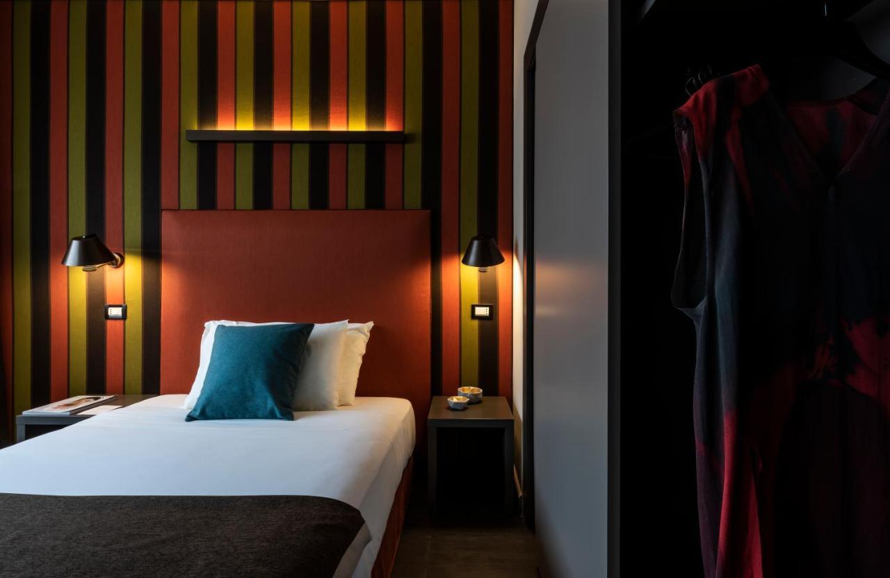 Fifty House Cellini Hotel Milan Exterior photo A room at the hotel