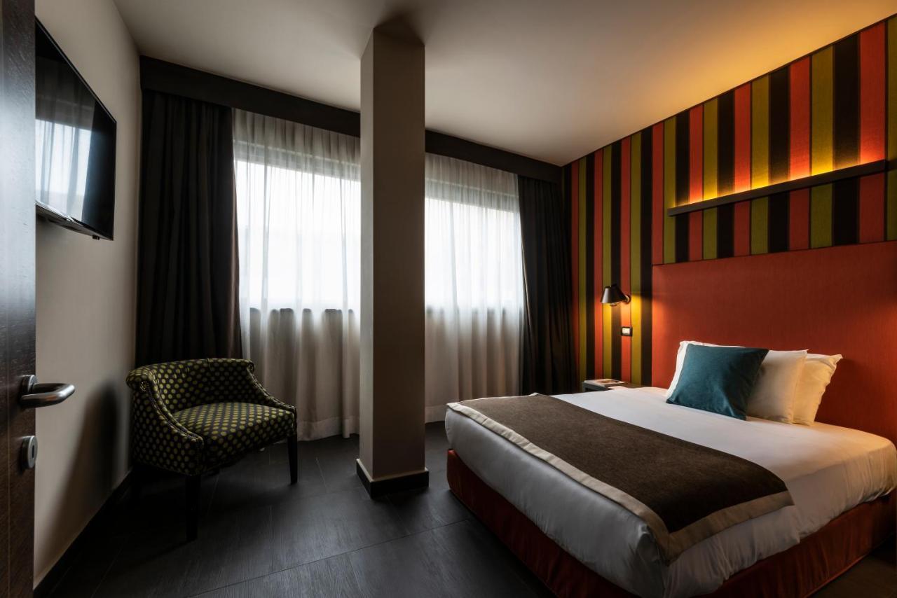 Fifty House Cellini Hotel Milan Exterior photo A room at the hotel