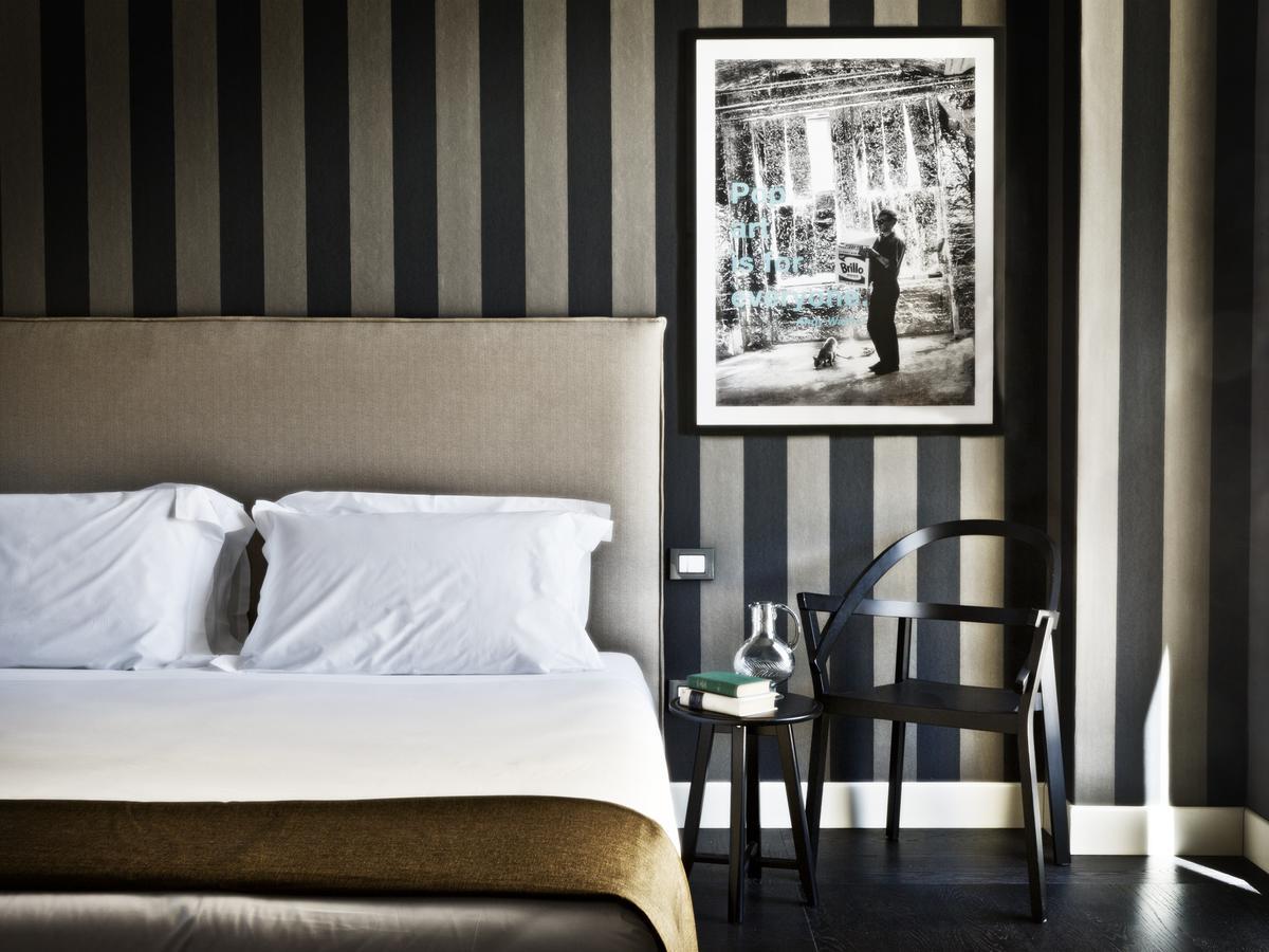 Fifty House Cellini Hotel Milan Exterior photo A room at the hotel
