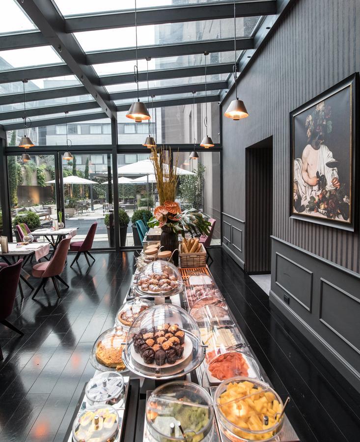 Fifty House Cellini Hotel Milan Exterior photo The interior of the restaurant