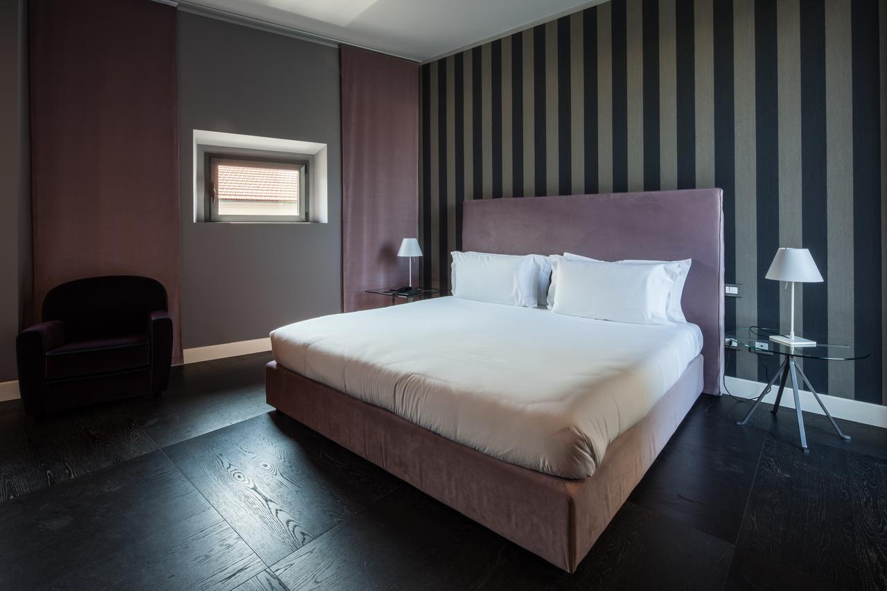 Fifty House Cellini Hotel Milan Exterior photo A room at the hotel
